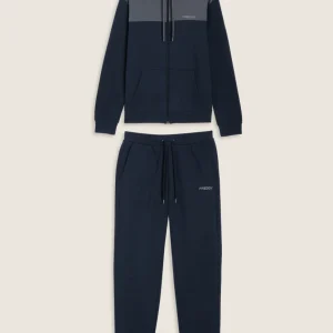 Tuta con cappuccio colour block e fondo a costine