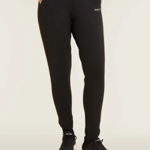 Pantaloni slim fit con spacchi laterali