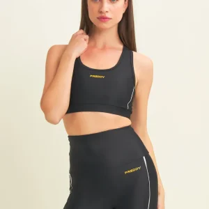 Top tecnico con spalline incrociate e profili bianchi