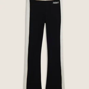 Pantaloni slim flare in felpa con bande laterali