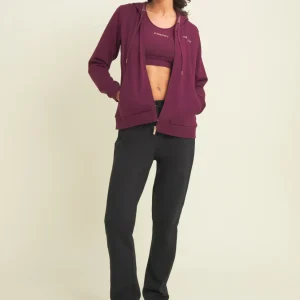 Tuta con cappuccio decorato da logo dorato a contrasto