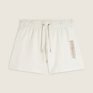 Pantaloni corti in jersey con grafica dorata