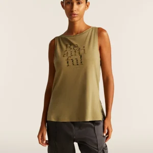 Canotta con fondo svasato e grafica con borchie