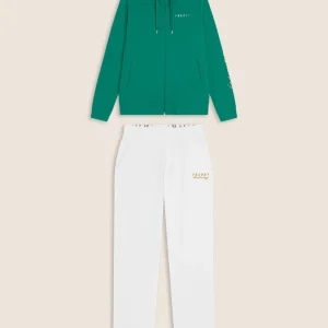 Tuta donna con zip, collo alto e spacchi laterali su fondo gamba