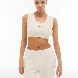 Crop top in cotone a costine con logo ricamato
